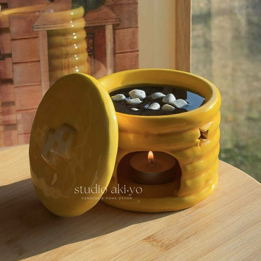 Bring a slice of Stars Hollow into your home with this cozy wax melt burner inspired by the iconic Luke’s Diner. Designed to look like a fluffy stack of golden pancakes dripping with syrup and topped with butter, this whimsical piece doubles as both décor and function.