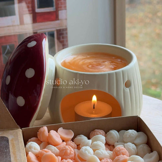 Mushroom cottagecore wax melt burner styled with botanical décor on wooden shelf