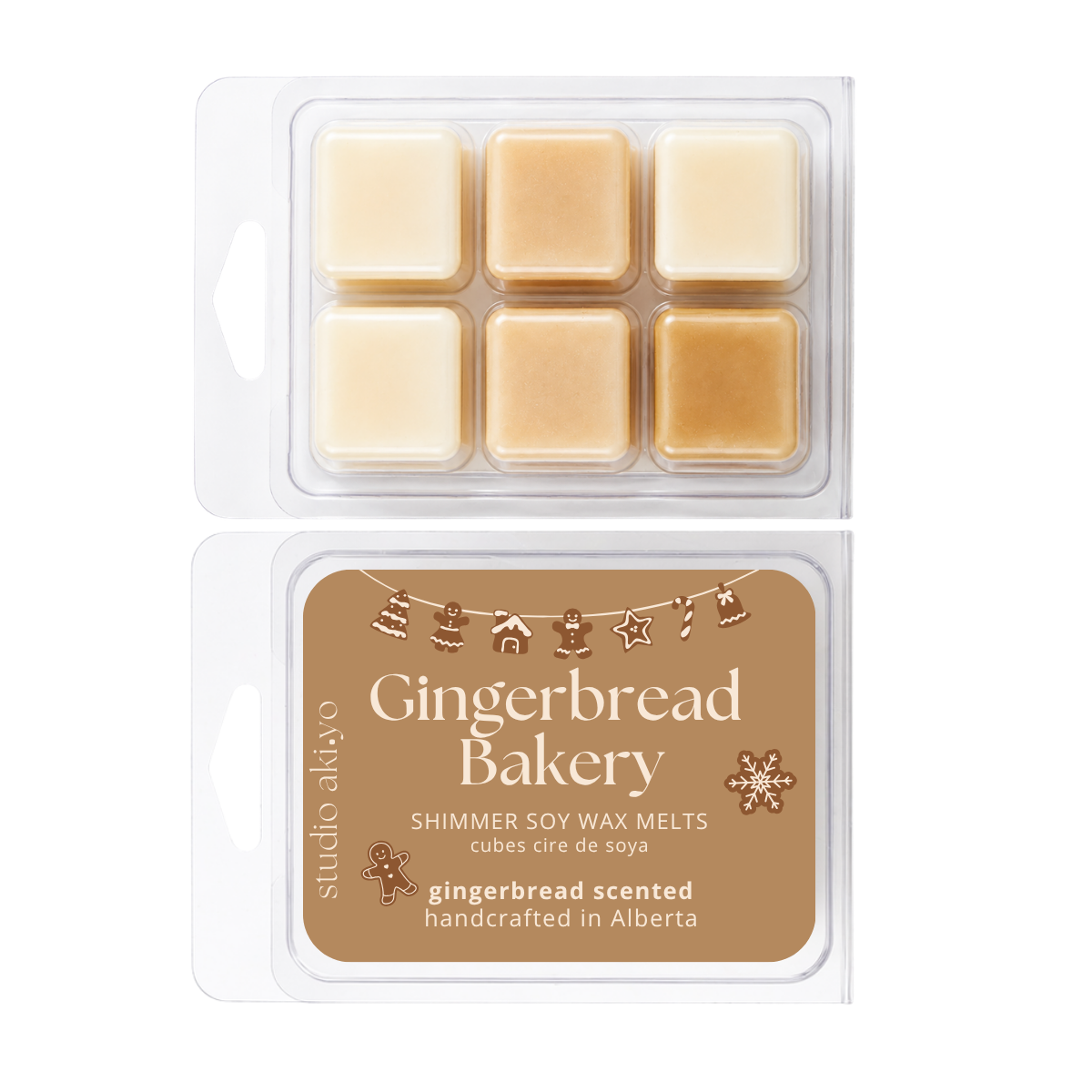 Two clear clamshell packages of Studio Albuo 'Gingerbread Bakery' shimmer soy wax melts. The top package shows six beige wax cubes arranged in a grid, while the bottom package displays a brown label with the product name and scent details.