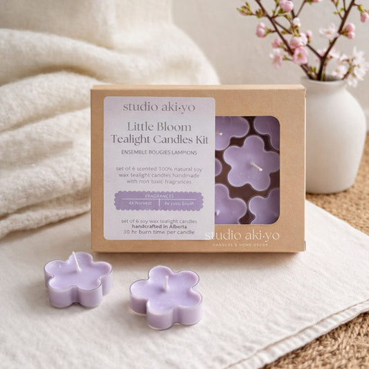 Studio Akiyo Little Bloom Tealight Candles Kit with two candles on a textured surface.