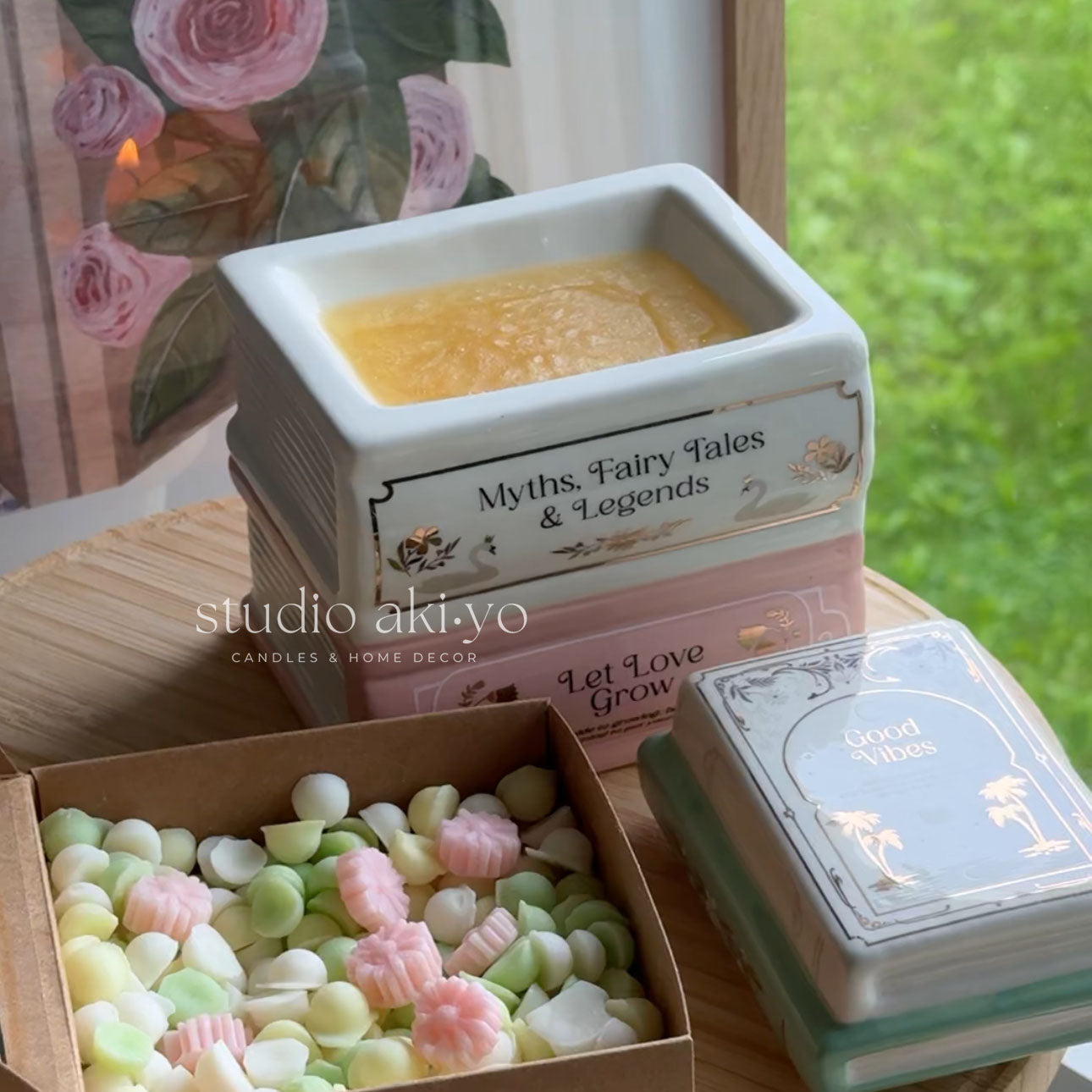 Decorative items including a small square container, a box of candy, and a card with 'Myths, Fairy Tales & Legends' text.