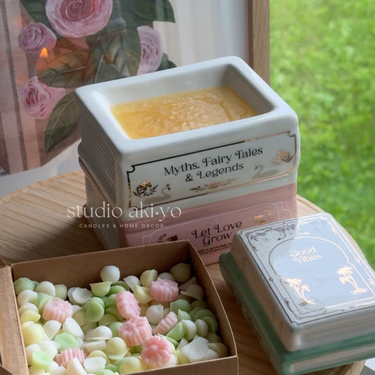 Decorative items including a small square container, a box of candy, and a card with 'Myths, Fairy Tales & Legends' text.