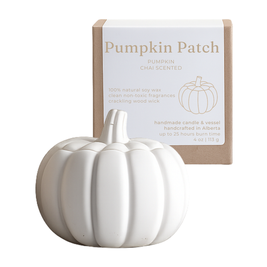 White ceramic pumpkin-shaped candle with 'Pumpkin Patch' packaging on a white background