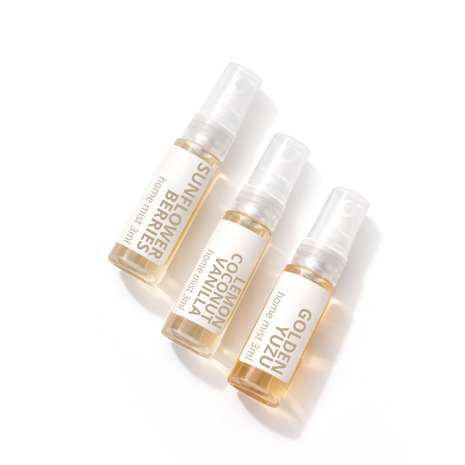 Three small Studio Akiyo home mist bottles with visible brand names on a white background. Featuring Scents Sunflower Berries, Lemon Coconut Vanilla and Golden Yuzu.