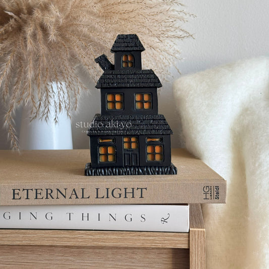 Haunted house incense cone holder with spooky window cutouts