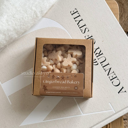 Box of gingerbread-themed wax melts on a magazine with 'studio aloha' branding.