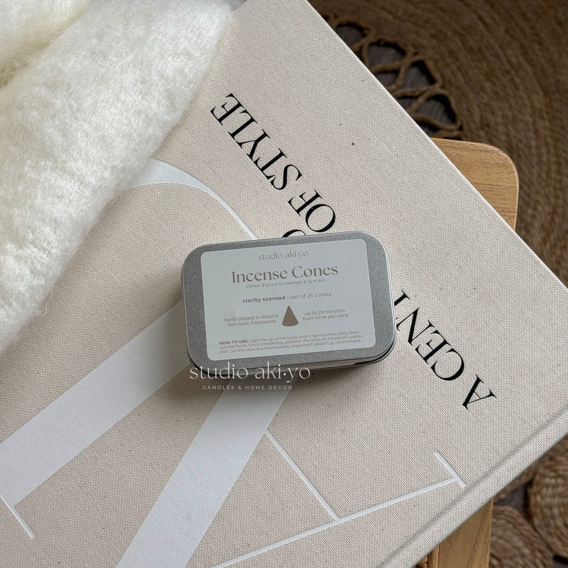 Metal tins with hand dipped incense cones called Clarity