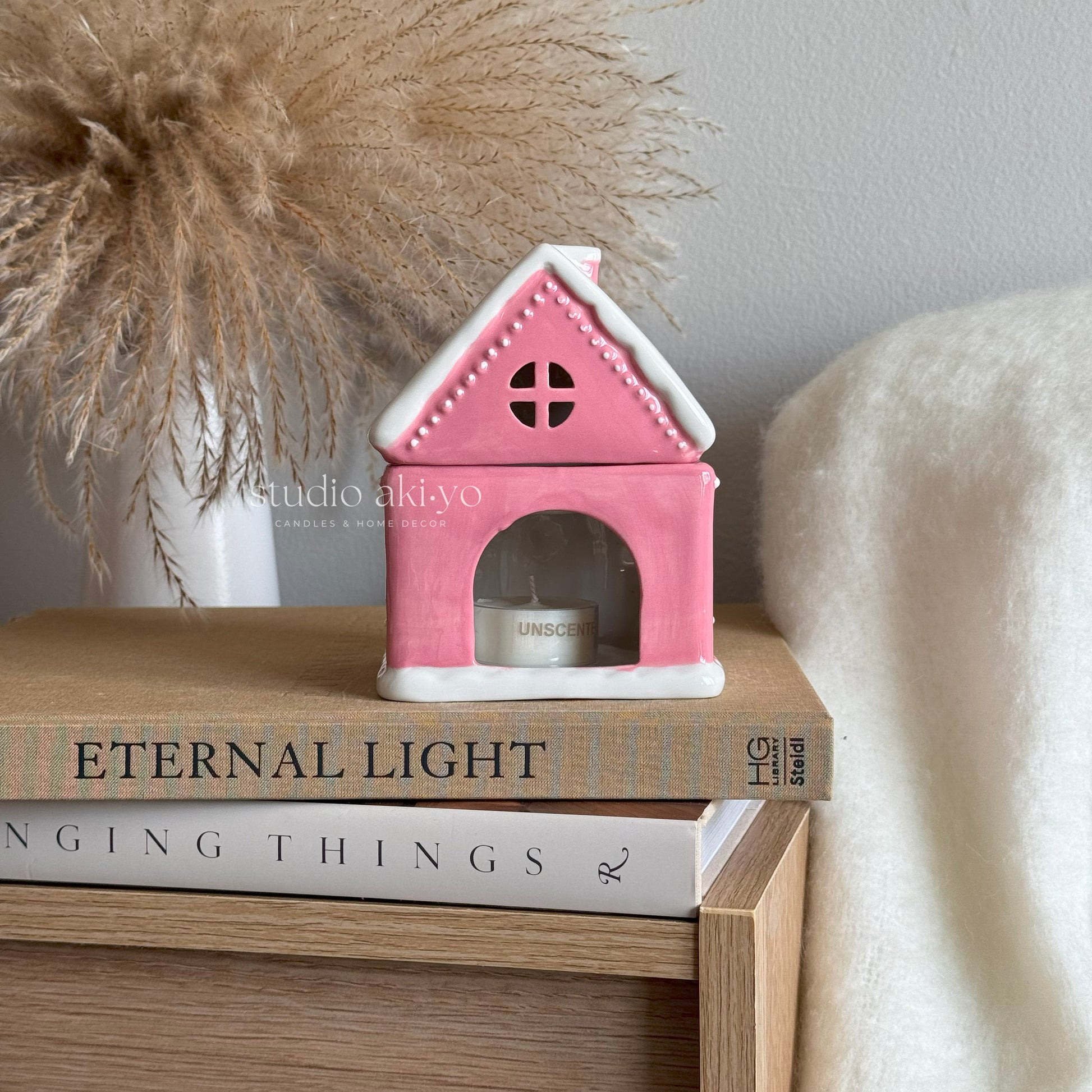 Pink ceramic gingerbread house wax melt burner.