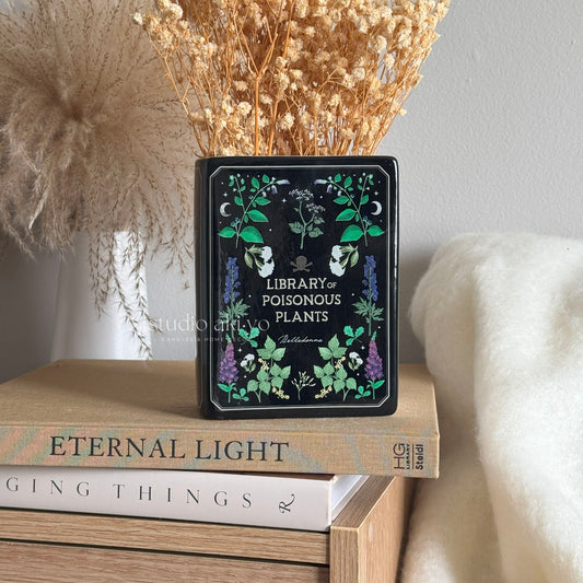 Ceramic vase shaped like a vintage poisonous plants book