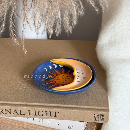 Stacked sun and moon trinket trays in ceramic with sun face and crescent moon design