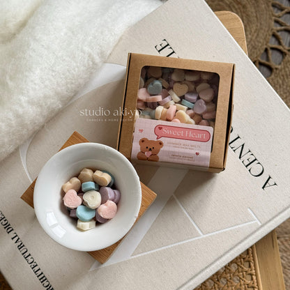 Sweet heart wax melts scoopies shaped like conversation hearts and scented with strawberry champagne