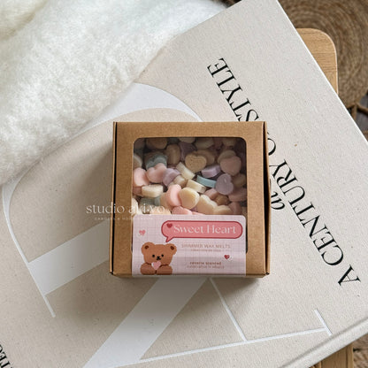 Sweet heart wax melts scoopies shaped like conversation hearts and scented with strawberry champagne