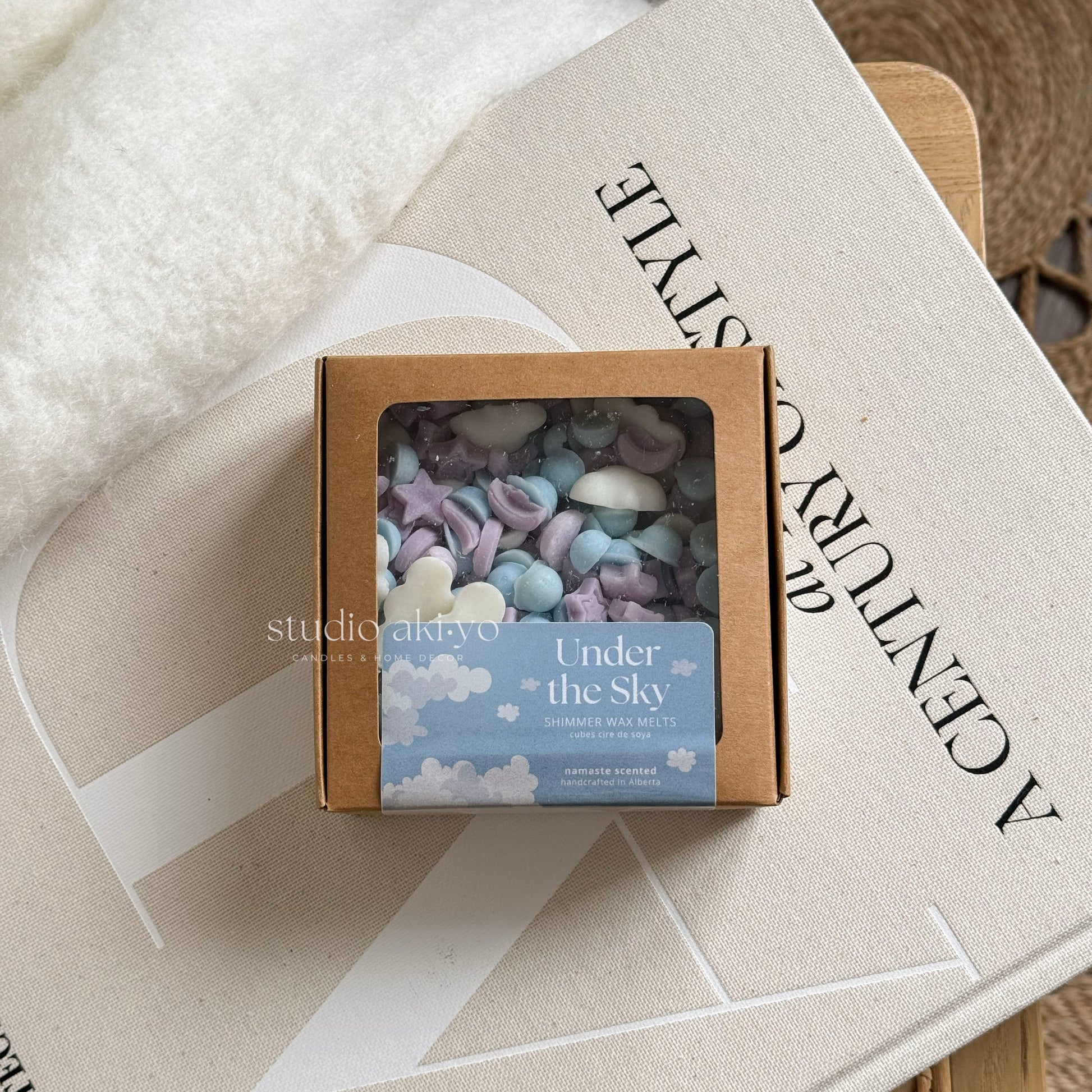 Under the sky wax melt scoopies shaped like a starry skies filled with clouds and stars