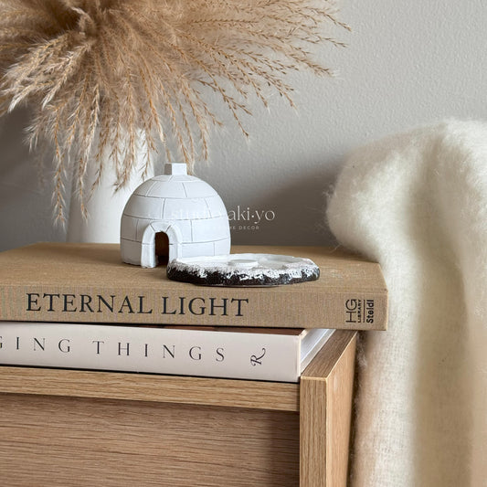 Igloo Incense Cone Holder on books with decorative elements in the background