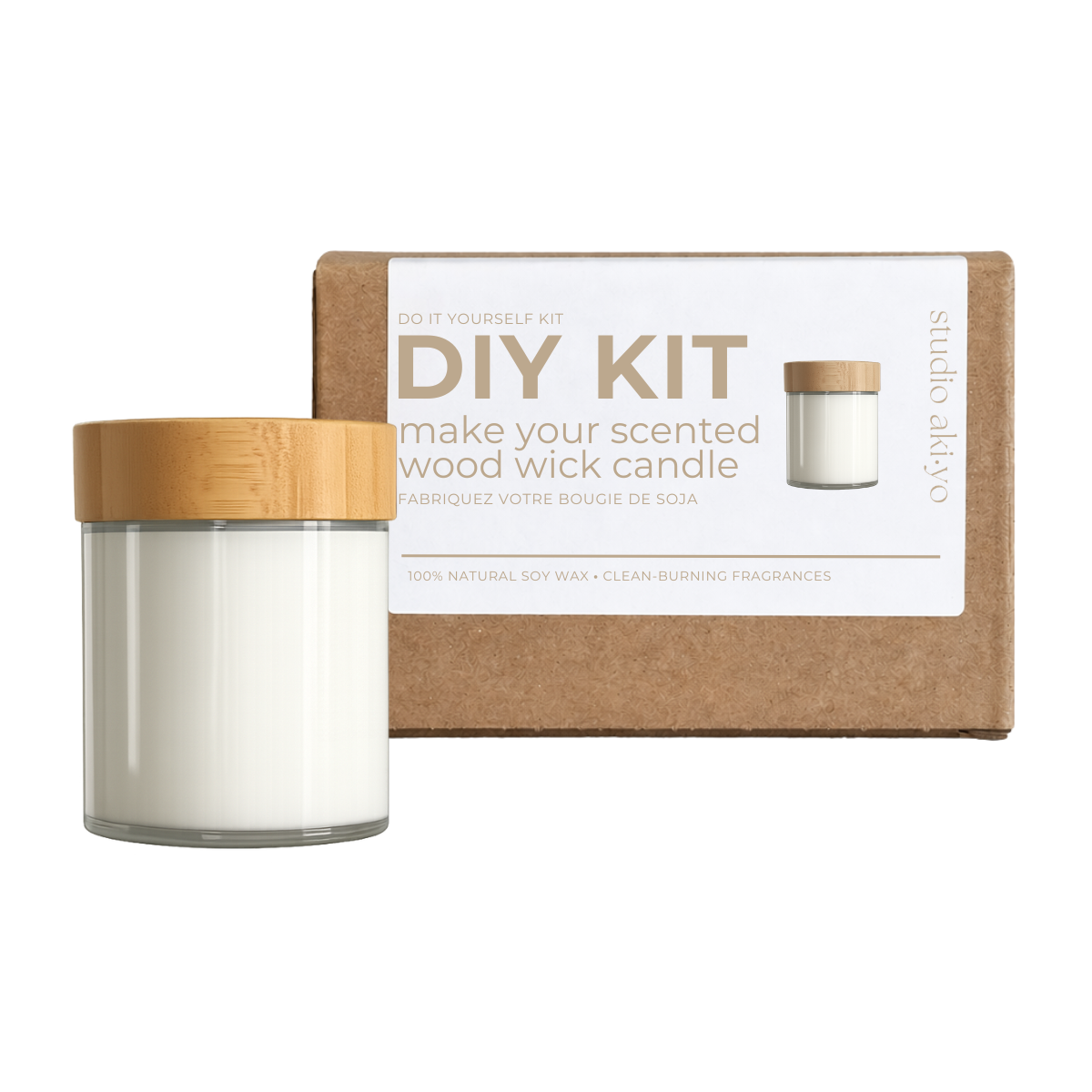 DIY candle kit with glass jar and wooden lid next to a cardboard box on a white background