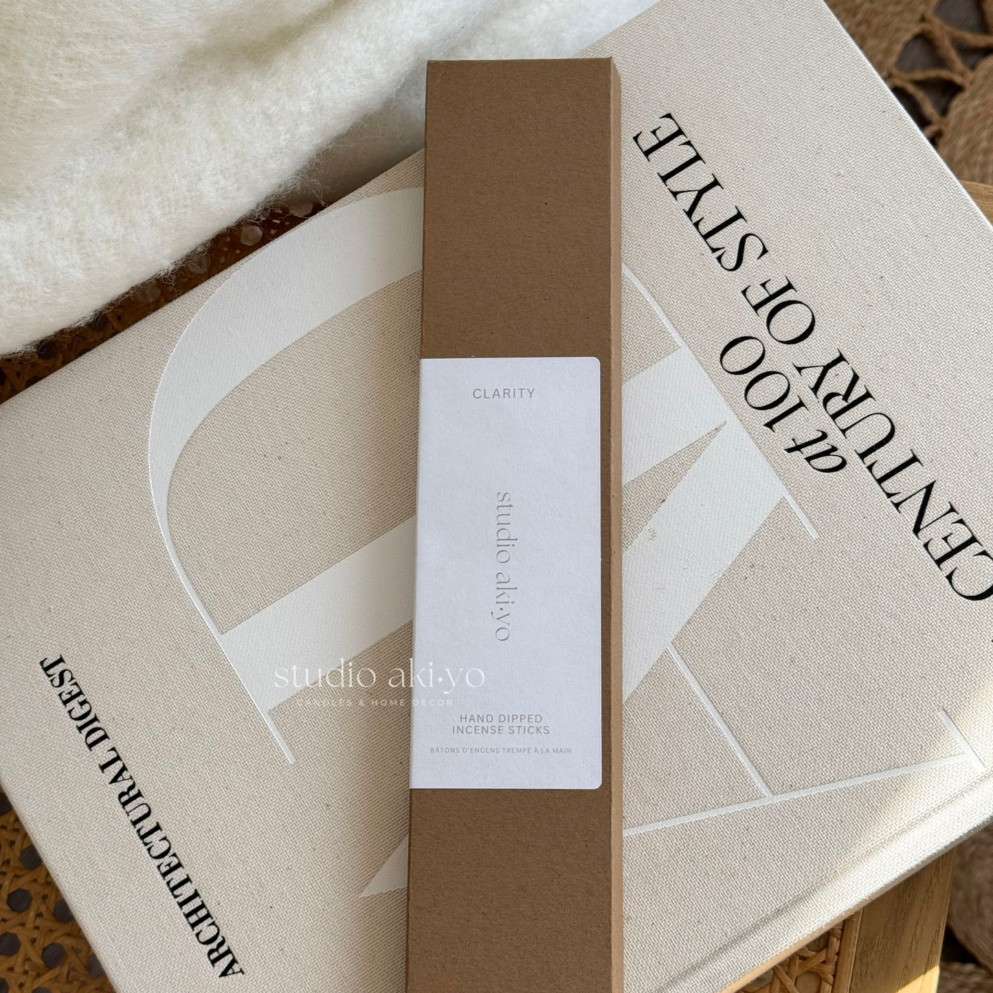 Box of studio axivo incense sticks on a textured surface with visible branding.