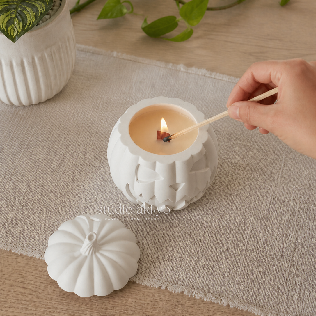Hand lighting studio akiyo pumpkin hollow scented candle.