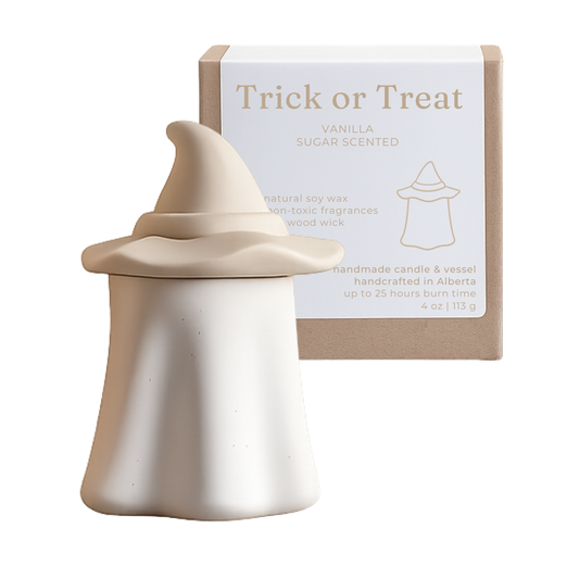 Vanilla-scented candle with packaging labeled 'Trick or Treat' on a white background