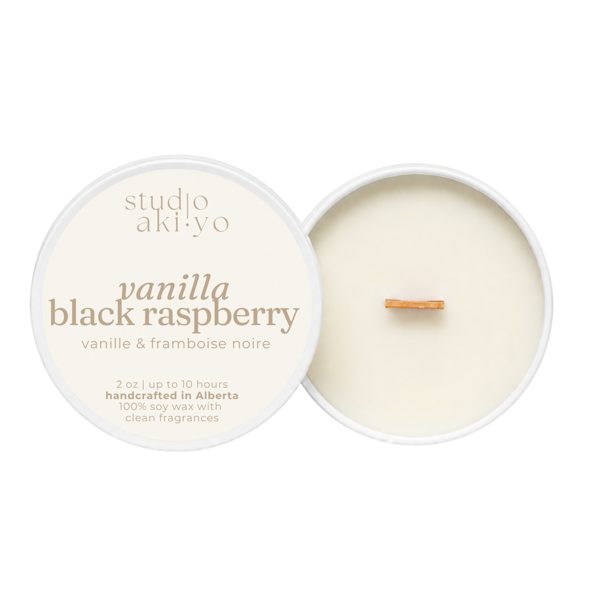 Studio aki-yo Vanilla Black Raspberry soy wax candle shown open with the cream-colored lid on the left and the wax pool and wick on the right, on a solid white background.