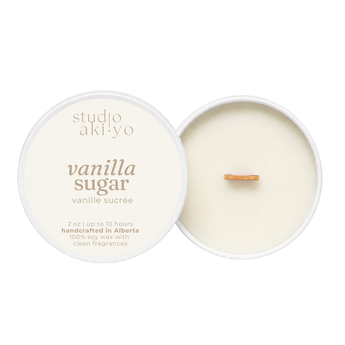 A round soy wax candle shown open with the cream-colored lid beside it on a white background. The lid reads 'studio aki·yo' and 'vanilla sugar' with smaller text below.