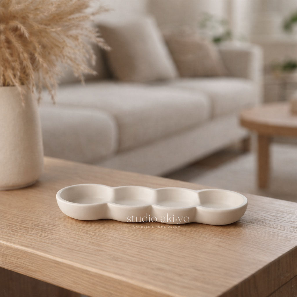 White ceramic tray on a wooden table with a blurred living room background
