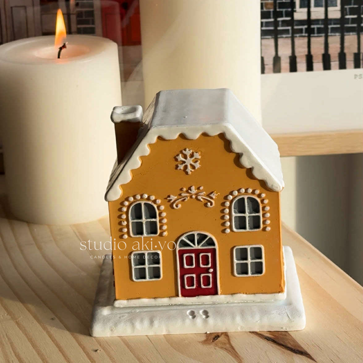 Candy Cane Gingerbread Incense Cone Holder on a shelf with books and a vase in the background