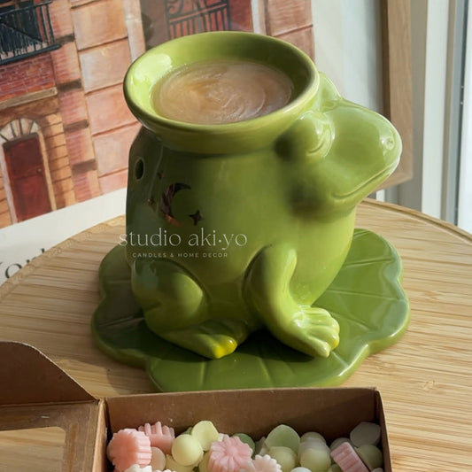 Luna frog ceramic wax burner on lily pad by Studio Akiyo