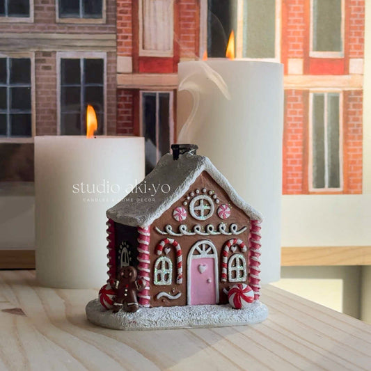 Pink Gingerbread Incense Cone Holder on books with a neutral background